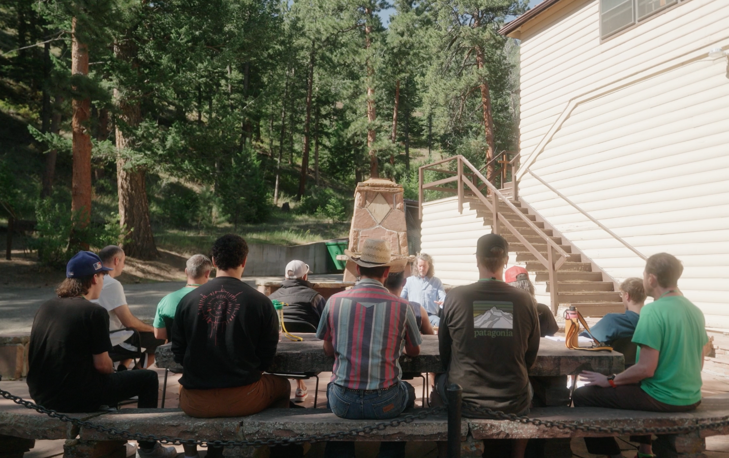 A group of individuals being led through meditation